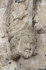 CASTET-ARROUY - église Sainte-Blandine ( XVIe siècle) - le porche : décor de l'arc ogival (tête d'ange)