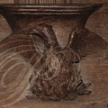 AUBAZINE - église abbatiale : stalles (fin XVIIIe siècle) - détail d'une miséricorde représentant le phénix