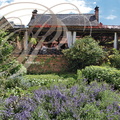 COLLONGES-LA-ROUGE - Auberge de Benges : la terrasse vue du jardin potager