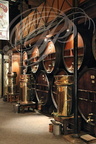 Distillerie DENOIX à Brive-la-Gaillarde (19) - foudres de vieillissement en chêne et cuves de filtrage