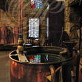 Distillerie DENOIX à Brive-la-Gaillarde (19) - reflet du vitrail dans la cuve au serpentin