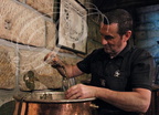 Distillerie DENOIX à Brive-la-Gaillarde (19) - soutirage de liqueur issue de la macération dans une conge en cuivre