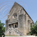 NAJAC - église Saint-Jean l'Évangéliste (XIIIe siècle) : la porte principale surmontée de la rosace du XVIe siècle
