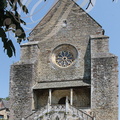 NAJAC - église Saint-Jean l'Évangéliste (XIIIe siècle) : la porte principale surmontée de la rosace du XVIe siècle 