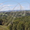 CUREMONTE_vue_panoramique_depuis_le_Puy_Turlau_au_Sud_Est_le_village_a_droite_a_l_horizon_a_gauche_la_forteresse_de_Turenne.jpg
